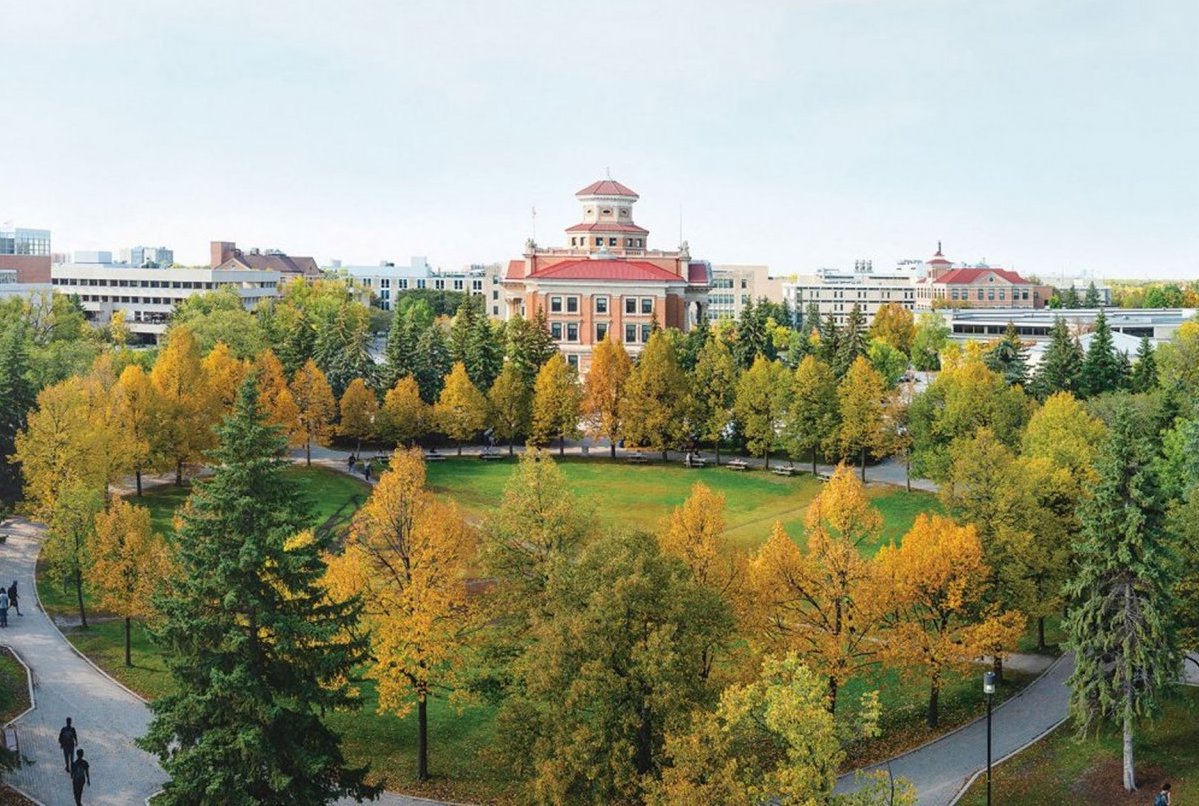 Overlooking the quad on Fort Garry campus, with tree leaves changing to orange in autumn.