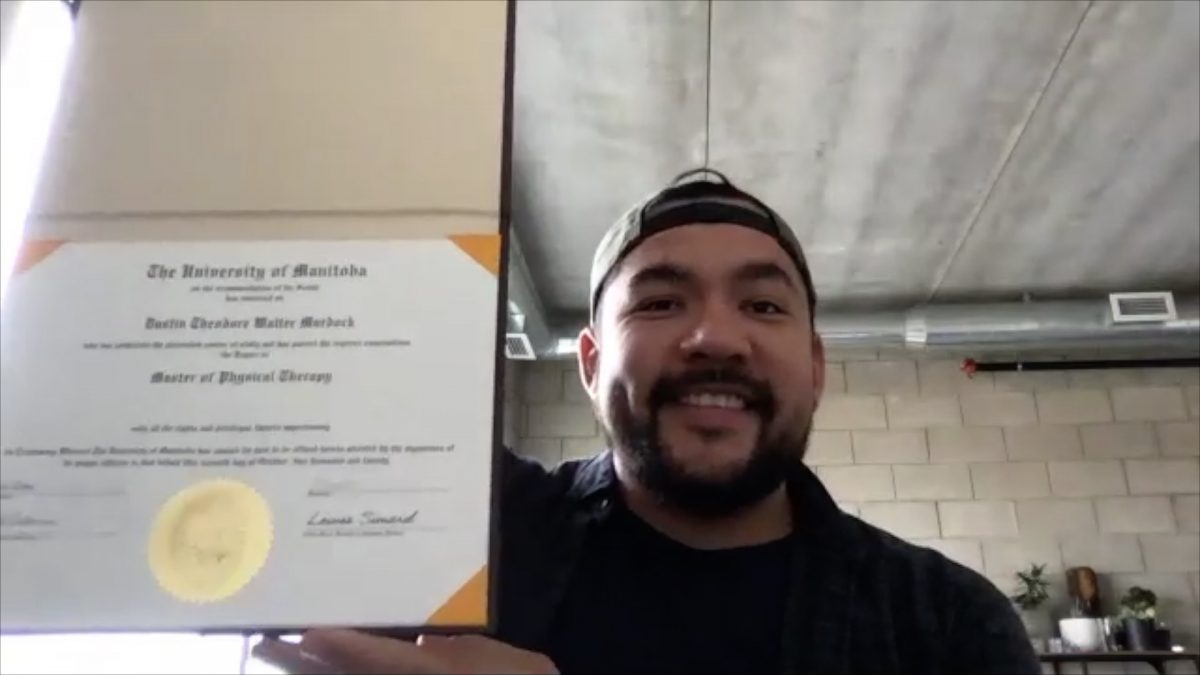 Dustin Murdock with his degree