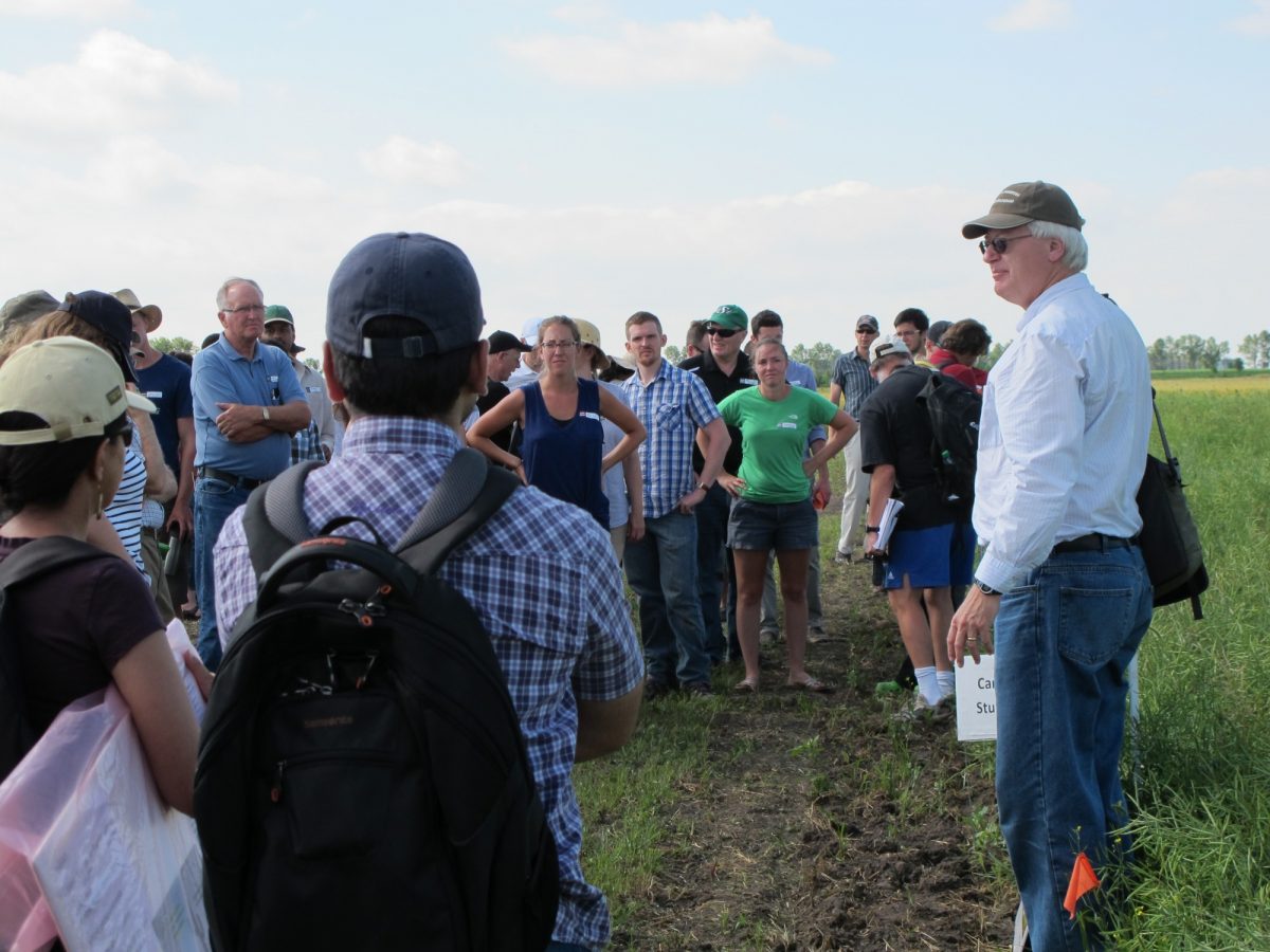 Don Flaten speaks to field tour