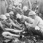 Australian troops: Men of the 10th Brigade who had been in the front line trenches for several days have a foot inspection