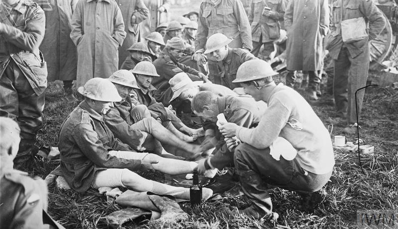 Australian troops: Men of the 10th Brigade who had been in the front line trenches for several days have a foot inspection