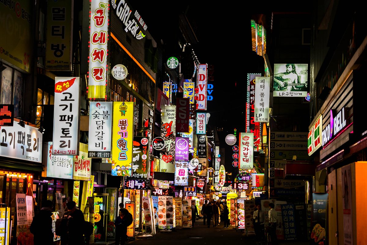 A photo of a busy South Korean street at night