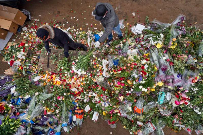  Flower shop employees destroy unsold flowers in St. Petersburg, Russia, after shops were ordered closed to limit the spread of the coronavirus, on Apr. 13, 2020. // AP Photo/Dmitri Lovetsky 