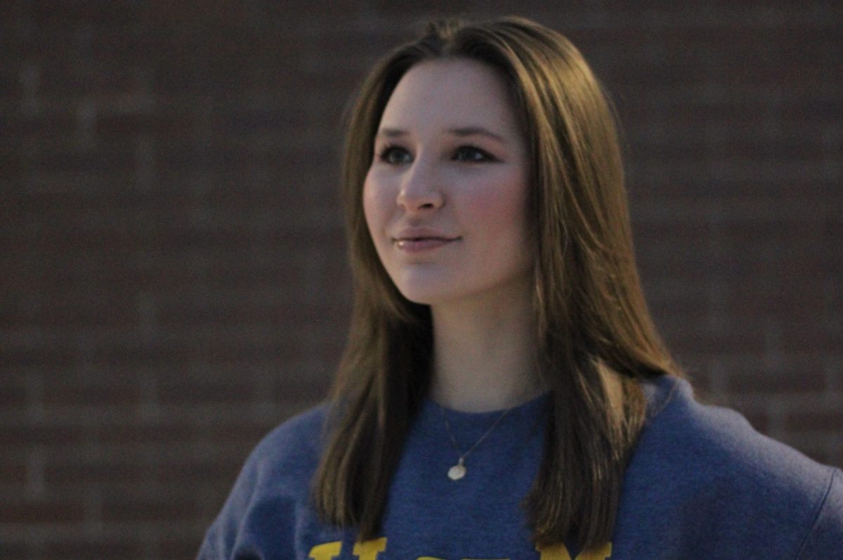 U of M student looking off into distance.