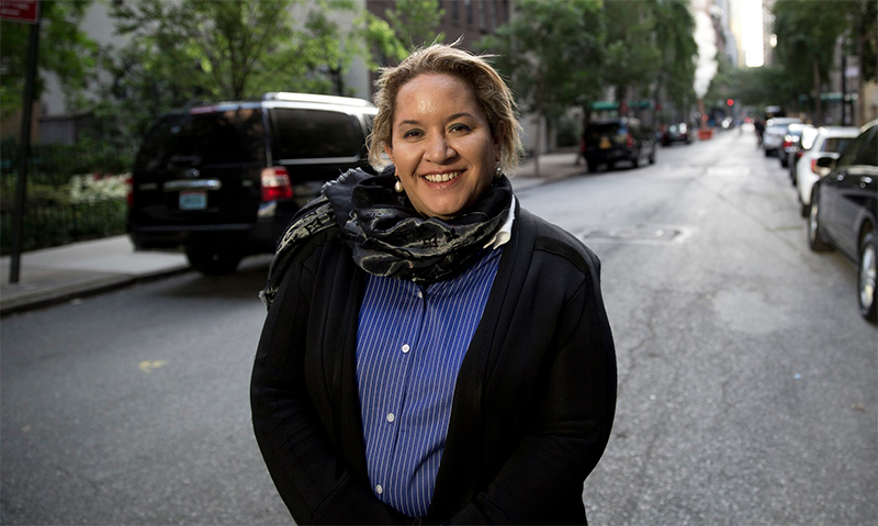 Professor Megan Davis smiling on a street in Australia.