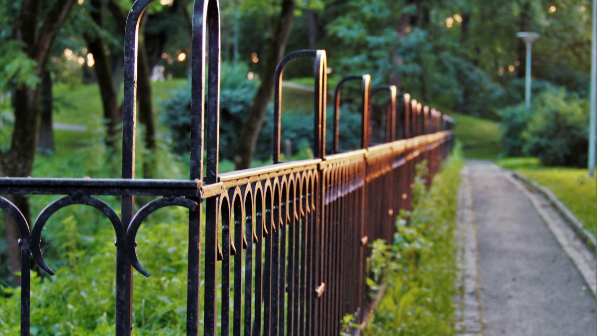 a fence in a park garden