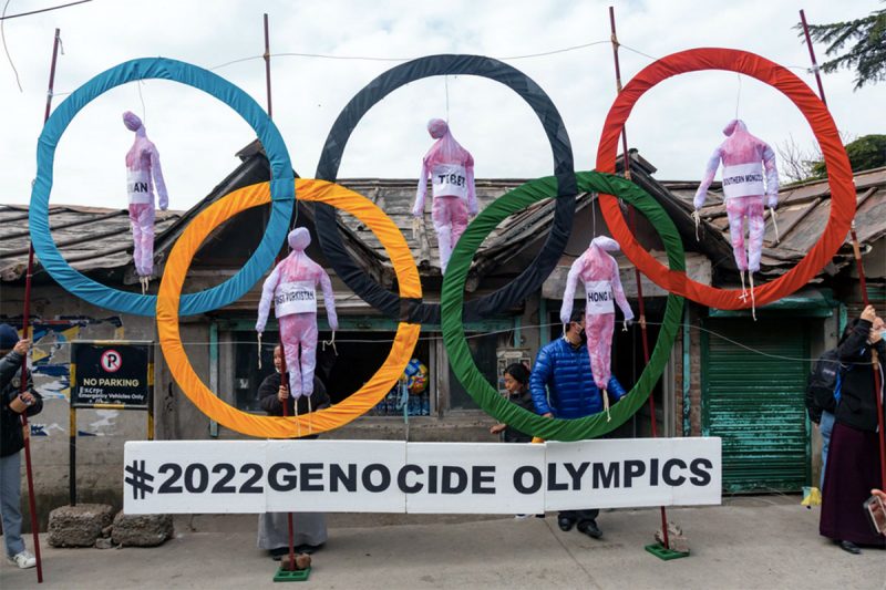 Exiled Tibetans in India use the Olympic Rings as a prop as they hold a street protest against holding the 2022 Winter Olympics in Beijing. Five effigies represent Taiwan, Tibet, Hong Kong, Inner Mongolia and the region ethnic Uyghurs call East Turkestan, under Chinese control. (AP Photo/Ashwini Bhatia)