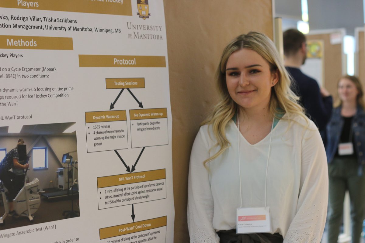 a student in frot of her research poster