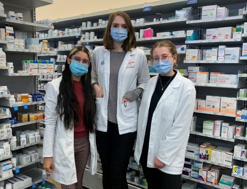 Preceptor Hilary Blahitka and students Stephanie Bansee and Stefanie Leslie stand in the Riverbend Shoppers Drug Mart. 
