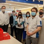 Pharmacy students, preceptors and pharmacy staff stand in the Southdale Shoppers Drug Mart.