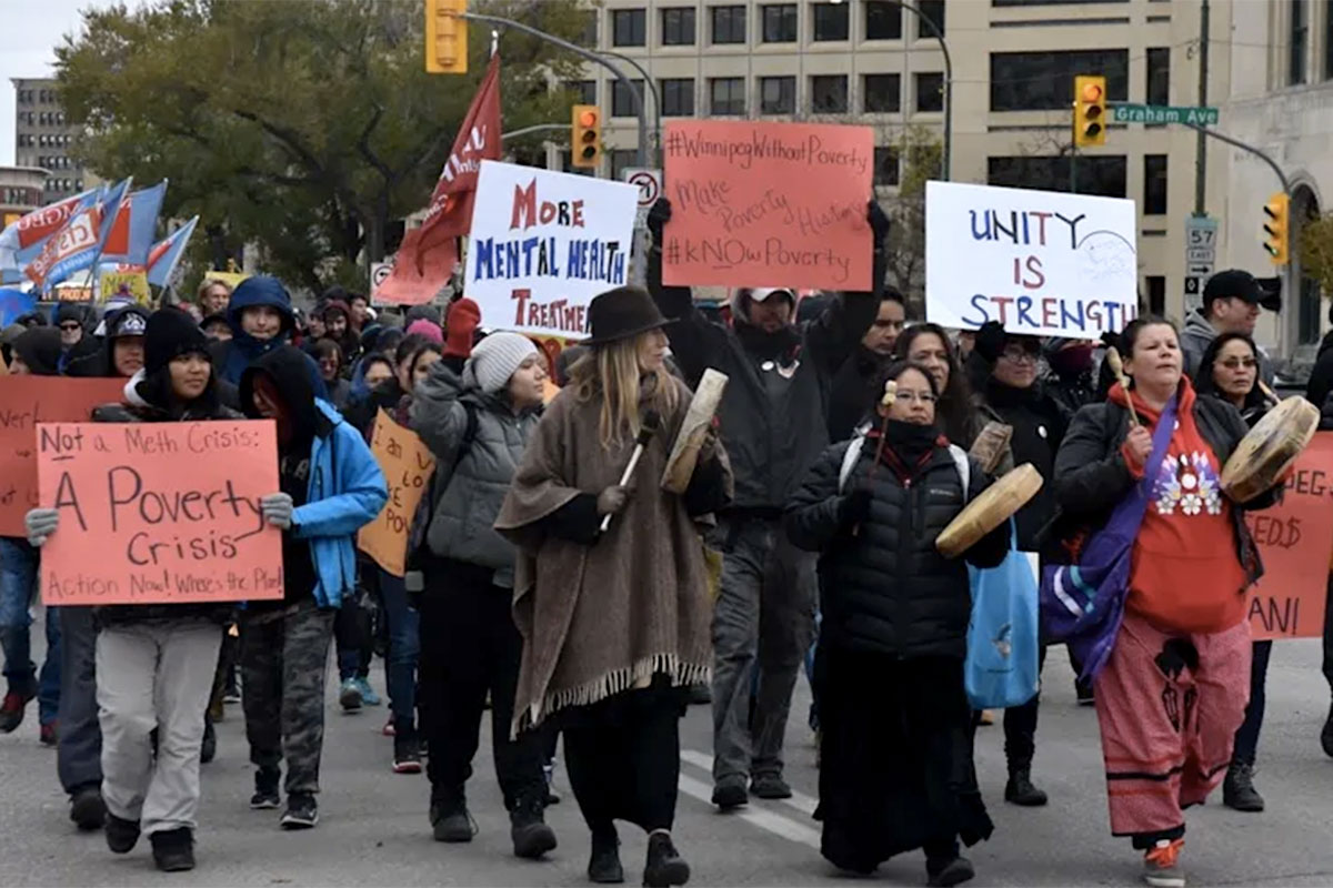 Anti-poverty protesters march in downtown Winnipeg in 2018. Andrew Tod/Manitoba Federation of Labour, Author provided