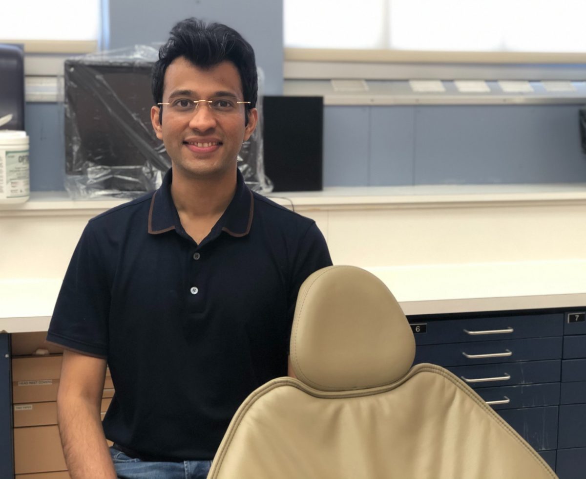 Dr. Rohan Kirtane sits in the dentistry clinic.