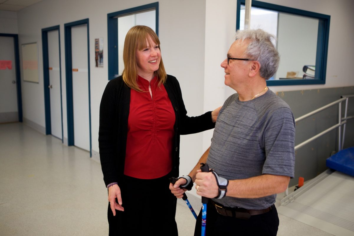 Ruth Barclay works with a client learning to use Nordic walking poles.