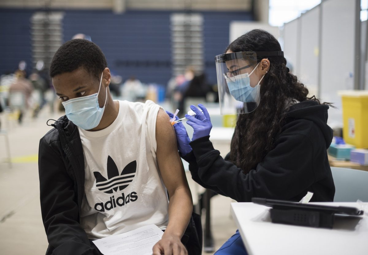 Little work has been done to understand young people’s willingness to receive COVID-19 vaccines. Above: a COVID-19 vaccination clinic at the University of Toronto Mississauga campus on May 6. THE CANADIAN PRESS/ Tijana Martin