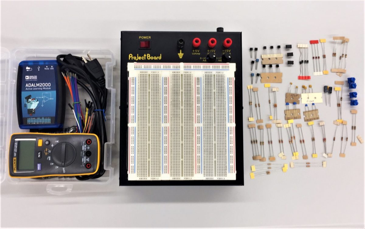 Lab in a box components, including the ADALM2000 test instrument.