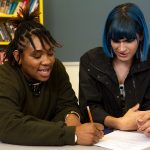 Two non-binary-students doing-work together in class. // Photo from The Gender Spectrum Collection / Zackary Drucker