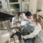 Students operating specialized microscopy equipment in NanoFab Laboraotry
