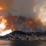 Wildfires burn on the island of Evia, north of Athens, Greece, on Aug. 3, 2021, as the country dealt with the worst heat wave in decades. Temperatures reached 41 C in parts of Athens. (AP Photo/Michael Pappas)