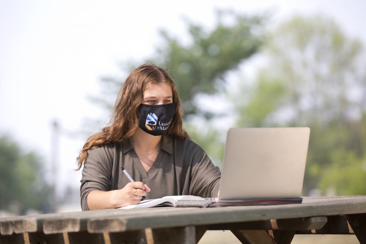 student-looking-at-laptop