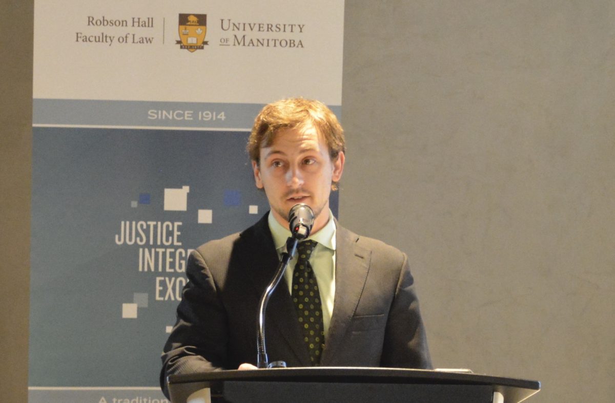 Brayden McDonald presents at a legal conference in 2018.