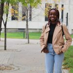 Student Chioma Nwagbo outside the Helen Glass Centre for Nursing at Fort Garry campus.