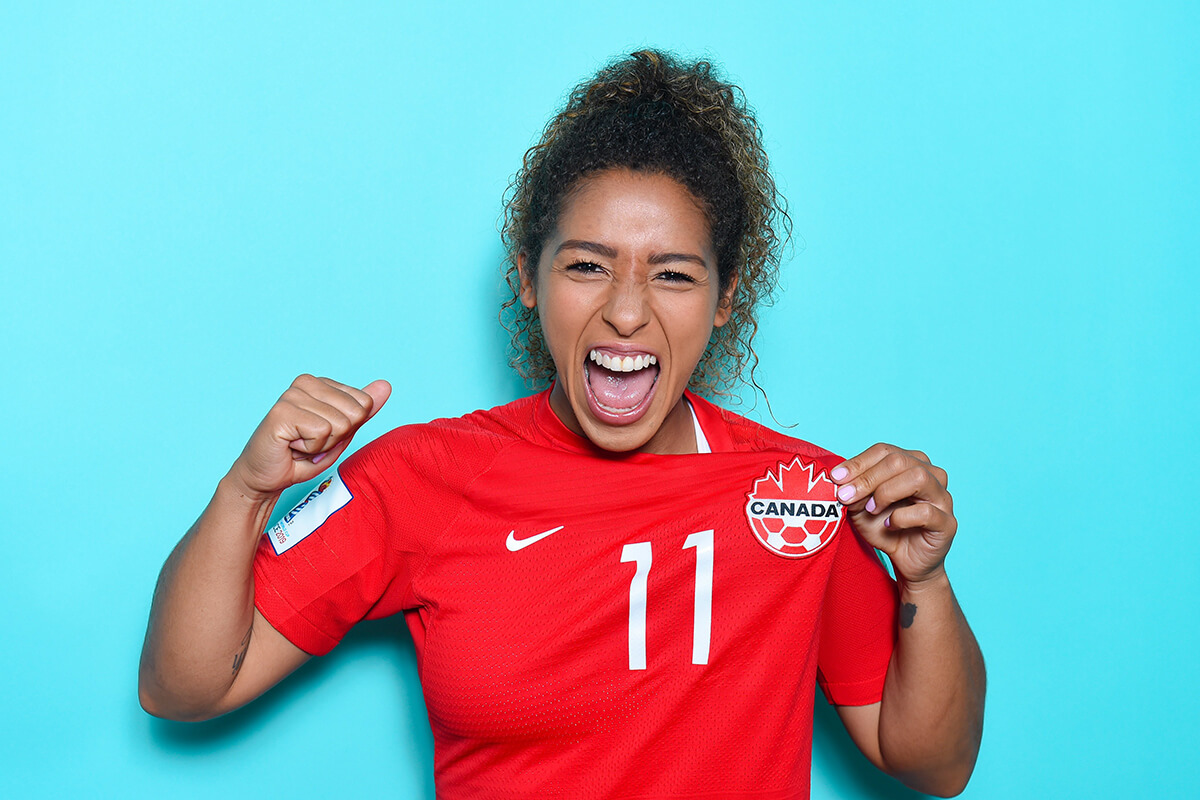 Desiree Scott poses proudly and shows off the logo on her shirt.