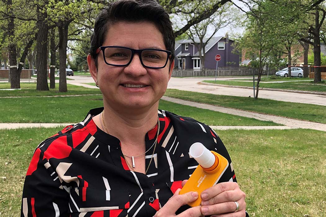 Dr. Diana Sanchez-Ramirez with a portable spirometer.