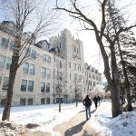 Students walk the path in front of Tier Building on Fort Garry campus in winter 2020.