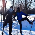 Two UM staff members posing while cross country skiing on Fort Garry campus.