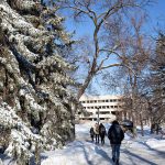 Students walking in winter on Fort Garry campus.