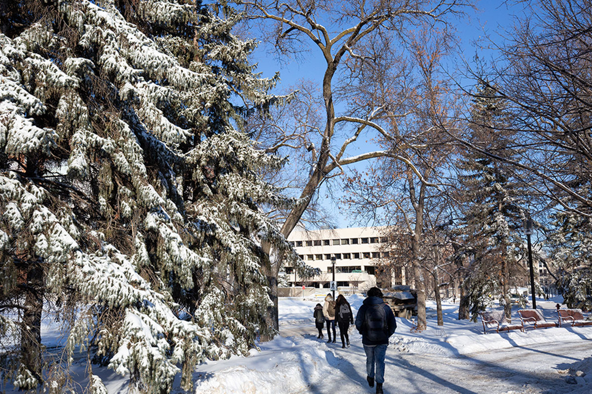 Students walking in winter on Fort Garry campus.