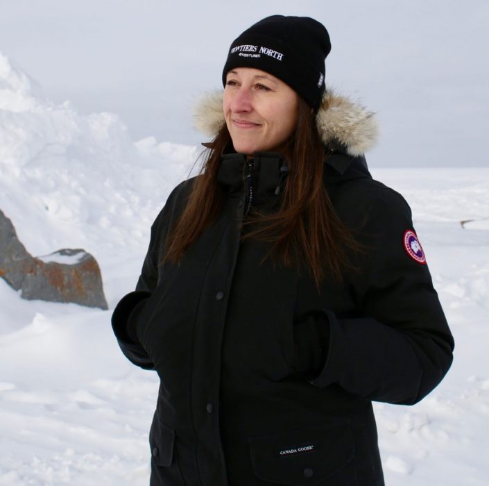 Asper M B A student, Jessica Burtnick, wearing a black jacket and toque in snowy Churchill, Manitoba.