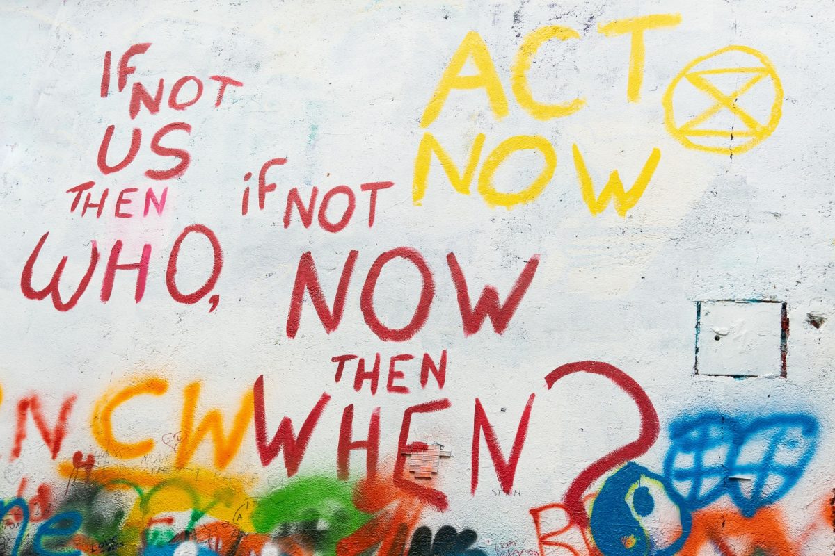Street art in Prague reads: "if not us then who, if not now then when?"