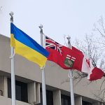 The Ukraine flag next to the Manitoba flag and the Canadian flag on Fort Garry campus. The Ukraine flag was raised on March 10, 2022, outside of UMSU University Centre. // Photo from Donna Rutkowski