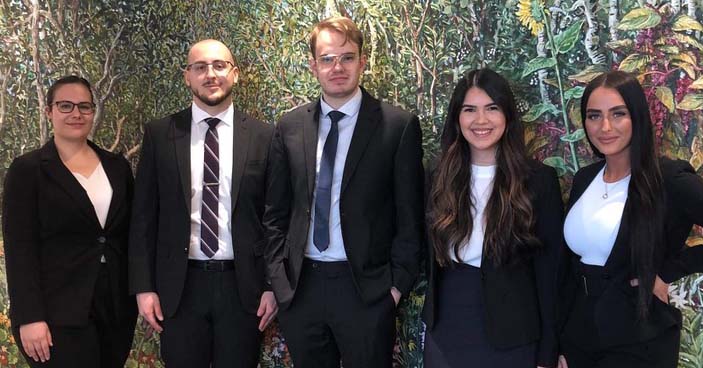 UM Law 2022 Davies Moot Competition team of 5 law students standing side by side.