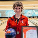 Marissa Naylor stands with a bowling ball and a certificate after placing 2nd in the Team Canada tenpin bowling trials