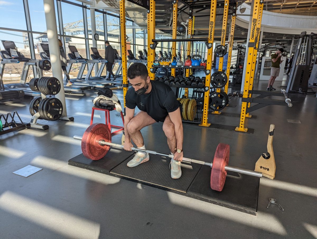 Amirali lifts weights