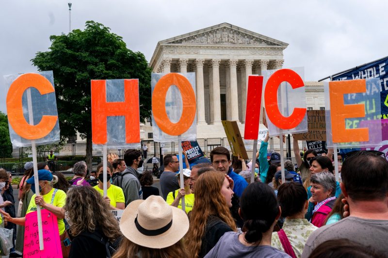 Abortion-rights demonstrators hold up letters spelling out ‘My Choice,’ Saturday, May 14, 2022, outside the United States Supreme Court in Washington, D.C. (AP Photo/Jacquelyn Martin)