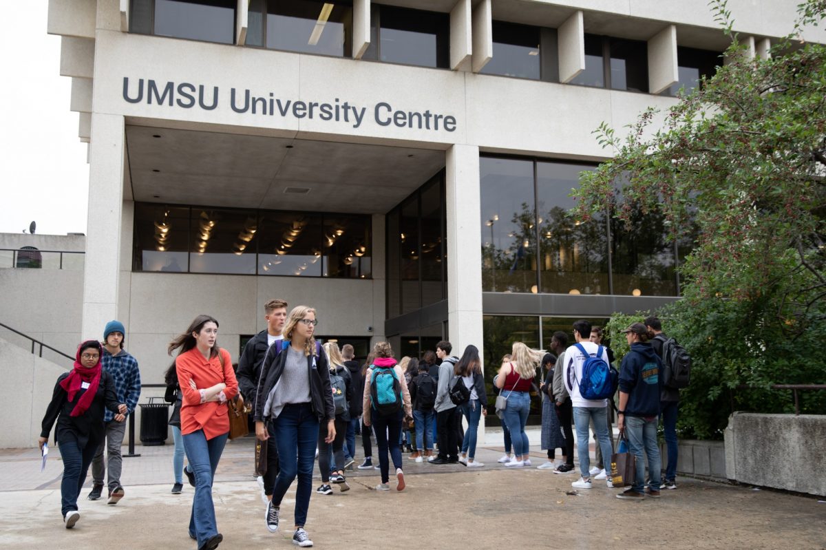 students walking outdoors at the university centre