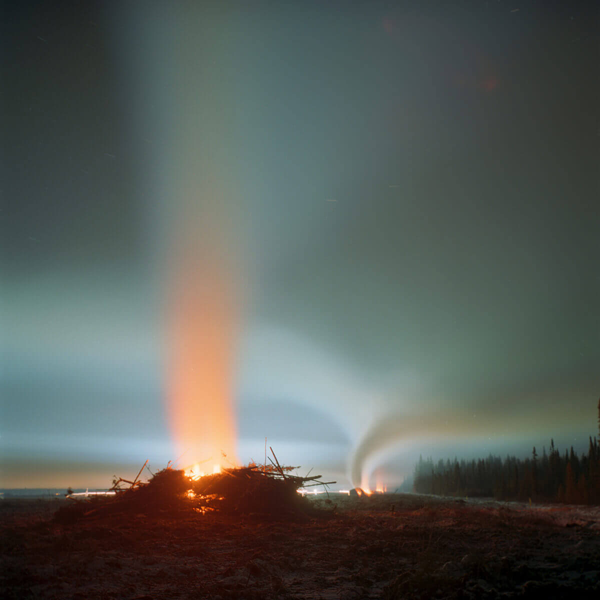 A long exposure photo of a bonfire.
