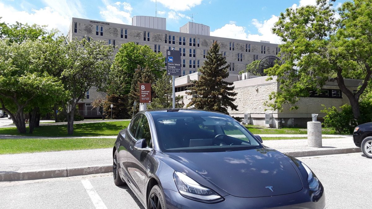 Electric vehicle parked and charging in B lot.