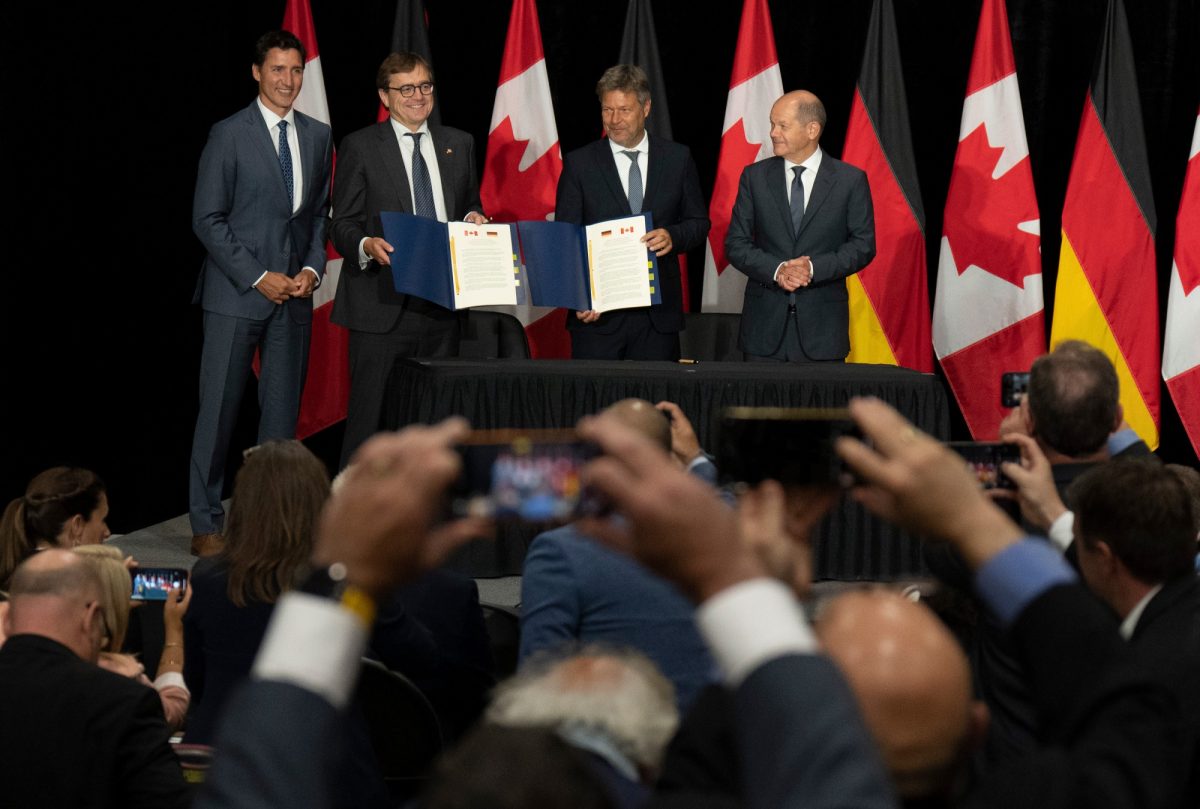 Canadian Prime Minister Justin Trudeau, Natural Resources Minister Jonathan Wilkinson, German vice-chancellor Robert Habeck and German Chancellor Olaf Scholz at a hydrogen energy deal signing ceremony on August 23, 2022 in Stephenville, Newfoundland and Labrador. THE CANADIAN PRESS/Adrian Wyld