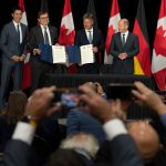 Canadian Prime Minister Justin Trudeau, Natural Resources Minister Jonathan Wilkinson, German vice-chancellor Robert Habeck and German Chancellor Olaf Scholz at a hydrogen energy deal signing ceremony on August 23, 2022 in Stephenville, Newfoundland and Labrador. THE CANADIAN PRESS/Adrian Wyld