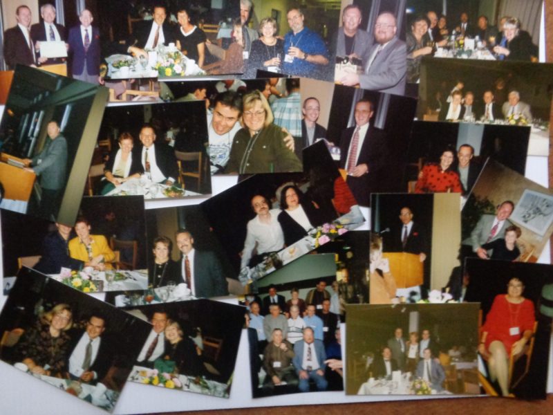 A group of photos on a table depicting the 25th Anniversary
