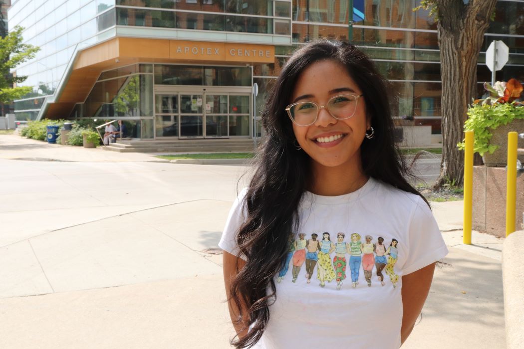 Marina Costa Fujishima stands outdoors on the Bannatyne campus.