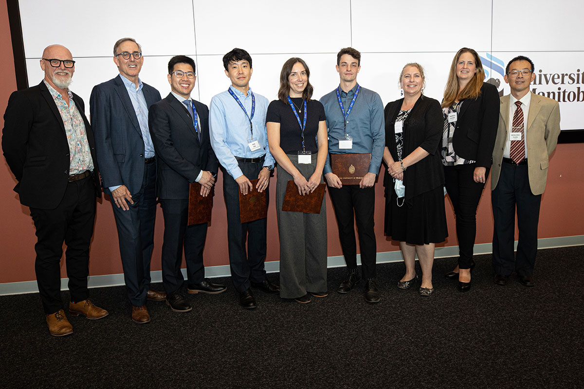 (Left-right) Darren Fast (Director, UM Partnerships and Innovation), Jay Doering (Associate Vice-President, Partnerships), Andrew Tse, Mun Kim, Natasha Theriault, Calvin Howard, Joelle Foster (Judge), Andrea Legary (Judge), Wenlong Yuan (Judge).