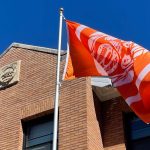 Orange survivor flag blowing in the wind.