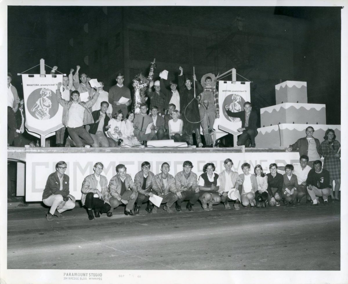 Group of students sitting on a parade float