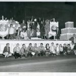 Group of students sitting on a parade float