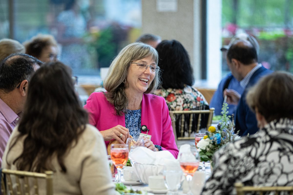 Staff and faculty around a table at the recent Long Service Awards.